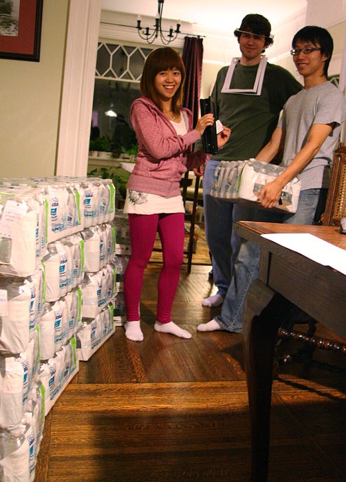 A team of workers labelled over 500 bottles with Newlife invitation tags - Cabbagetown Festival 2010