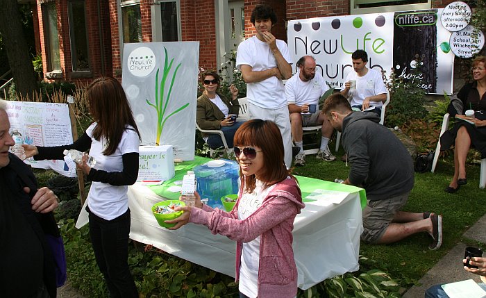 Handing out free water and candies to passers by - Cabbagetown Festival 2010