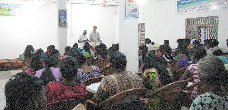 Andrew preaching at the church